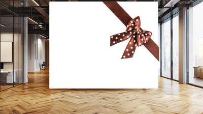 Shiny brown silk ribbon on white background. Wall mural