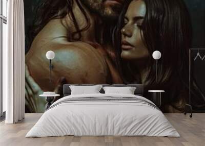 A tall, muscular man with long dark hair and stubble embraces a slender woman with closed eyes. Wall mural