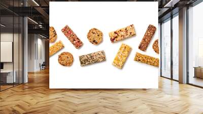 Energy healthy snack. Cereal granola bar with nuts and dry fruit berries. Fitness diet food. Protein muesli bars isolated on white background. Sport oatmeal bar, top view Wall mural