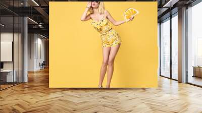 Fashionable Blond model with Kiss Face, Trendy Sunglasses. Stylish Glamour fashion woman Having Fun in Summer Yellow Outfit. Young Beautiful European Hipster girl Posing in Studio Wall mural