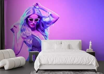 High Fashion. Gorgeous Disco Party girl with neon glowing purple dyed hair dance. Young beautiful fashionable model woman enjoy music, party make up, Night Clubbing. Colorful neon light banner Wall mural