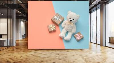 Valentines Day. Teddy Bear with gift boxes, ribbon. Creative art fashion greeting card. Pastel design coral blue color, cute toy bear and presents. Flat lay. Holiday gift shopping fashionable concept Wall mural