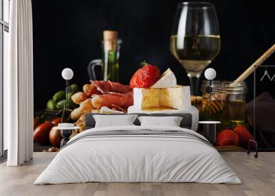 Brie cheese, camembert, grissini, jamon, wine, nuts, honey. Snacks for wine. Wall mural