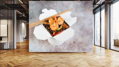 Stir fry with buckwheat noodles, vegetables and shrimp in soy sauce. A box of Japanese takeaway. Wall mural