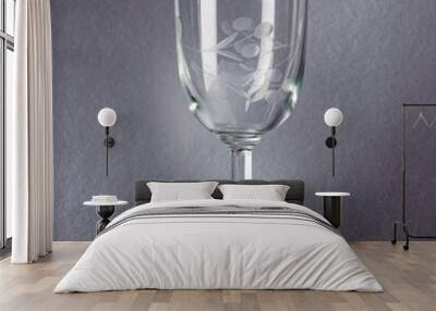 glass of clear glass, for strong drinks, on a gray background Wall mural