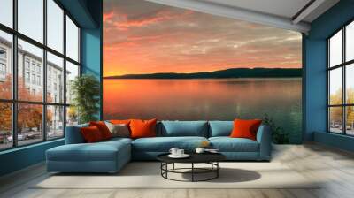 bright sunrise on the bank of forest lake Wall mural