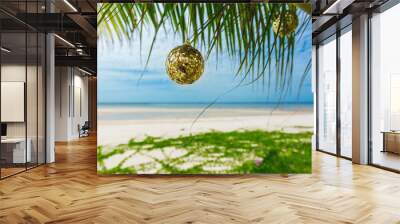 Christmas decoration on the palm on the beach on sunny day Wall mural