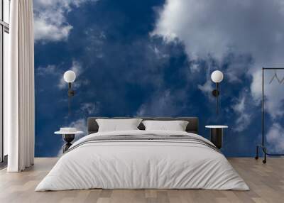 Dark blue sky and white clouds, heavens, daylight Wall mural