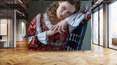 A thoughtful portrait of an aristocratic girl in a vintage Renaissance dress Wall mural