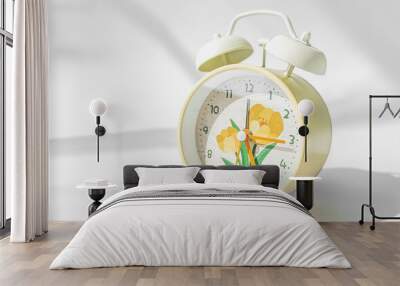 horizontal photo of yellow alarm clock with flowers on white background Wall mural