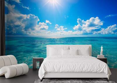 Summer background azure sea blue sky with clouds and bright sun Wall mural