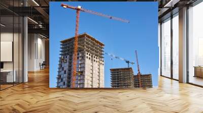 multistory buildings under construction, view against the sky Wall mural