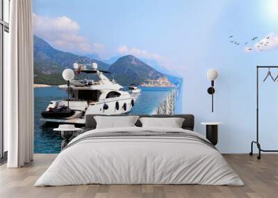 Creative picture bending - luxury yacht on turquoise water between the islands. Twisted reality. Curved space Wall mural