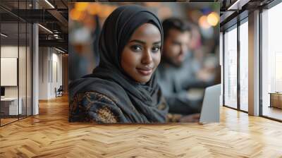 young woman in hijab working at a computer in a futuristic office Wall mural