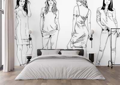 vector drawings on the theme of beautiful slim sporty girl in casual clothes in various poses painted ink hand sketch with no background Wall mural