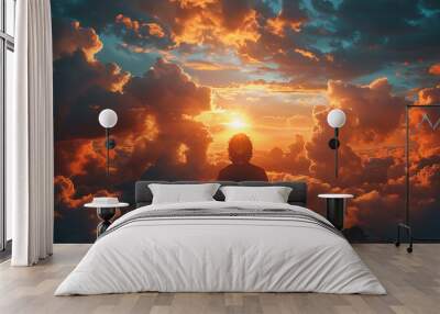 a man kneels and prays, hands folded and raised, and a ray of light falls from the sky
 Wall mural