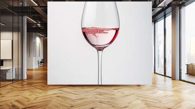 glass of rose wine on white background Wall mural