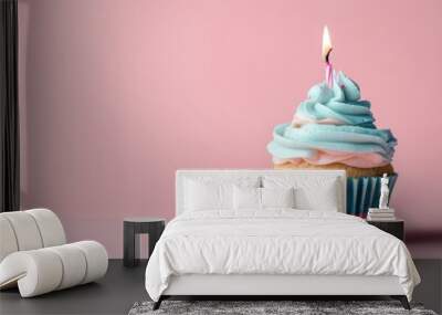 Light pink and light blue cupcake with one candle Wall mural