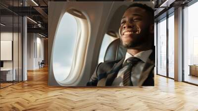 Smiling African American Businessman Flying in Airplane Wall mural