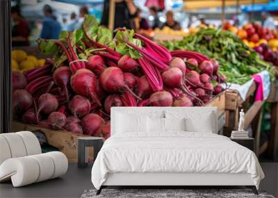 Yellow and red beetroots with leaves in wooden crates at farmers market. Wall mural