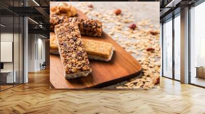 mixed gluten free granola cereal energy bar with dried fruit & various nuts, gray concrete backgroun Wall mural