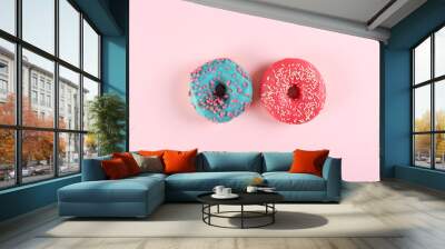 Top view composition of lush donut with colorful sprinkled icing, on bright paper textured background with a lot of copy space for text. Tasty but unhealthy food concept. Close up, flat lay, frame. Wall mural