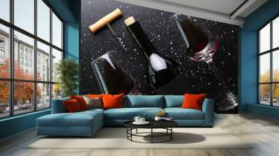 vintage bottle of red wine with blank matte black label, corkscrew on grunged concrete table backgro Wall mural