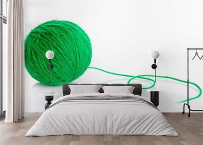 Green wool yarn ball isolated on white Wall mural