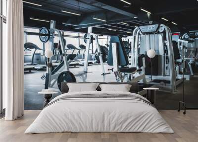 Modern light gym. Sports equipment in gym Wall mural