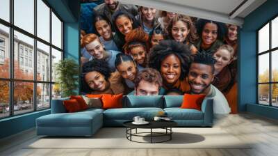 a diverse group of individuals standing close, smiling happily and looking towards the camera Wall mural