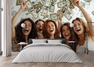 A group of five friends, laughing and smiling, enjoy a lively moment as they toss money into the air, creating a festive atmosphere in a well-lit space Wall mural