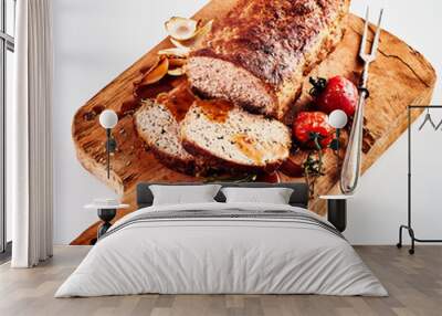 Carved roasted meatloaf on a chopping board Wall mural