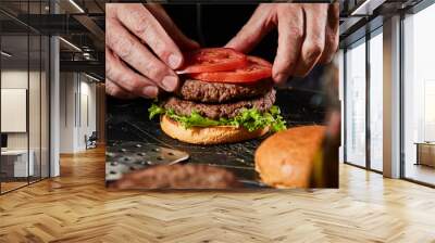 Chef preparing a double takeaway beef burger Wall mural