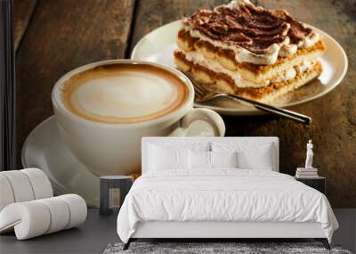 Cup of milk coffee with piece of cake Wall mural