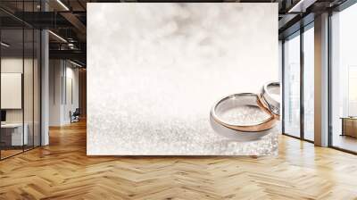 Designer wedding rings on a sparkling background Wall mural