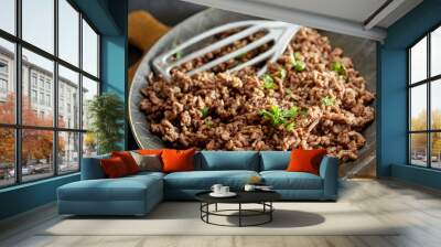 Fried minced meat on pan with green chives Wall mural