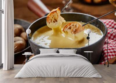 Pot of traditional Swiss cheese fondue Wall mural