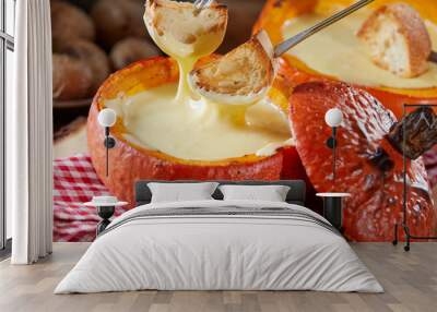 Tasty cheese fondue served in a pumpkin rind Wall mural