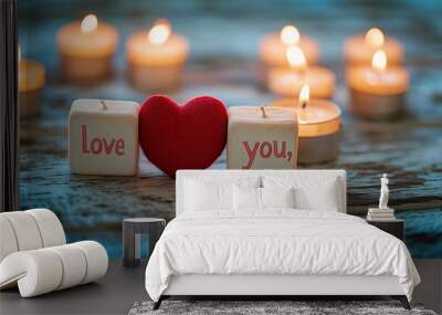 Close-up of concept candles arranged to say I love you, with a red heart resting on a textured wooden surface, the scene bathed in soft, natural light Wall mural