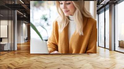 A professional businesswoman working from home, sitting at a desk with a laptop, surrounded by a cozy and organized home office setup, balancing work and life responsibilities Wall mural