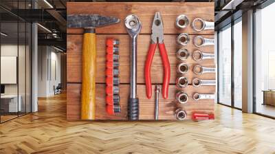 Set of different work tools on wooden surface Wall mural