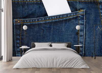 White card in a back pocket of a jeans Wall mural