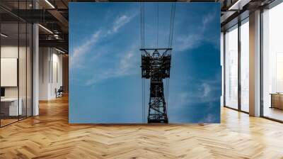 electric power transmission line with bright blue sky background Wall mural