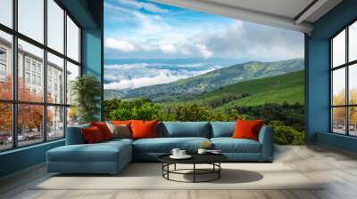 mountain coverd with cloud layers and beautiful sky Wall mural