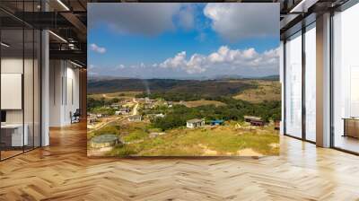 remote mountain village with bright blue sky at morning Wall mural