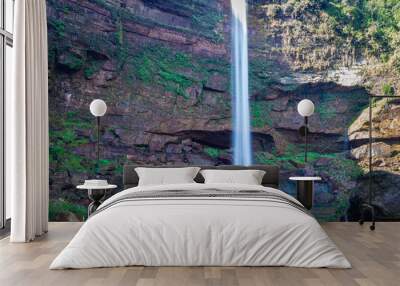 waterfall falling streams from mountain top with reflection from different perspective Wall mural