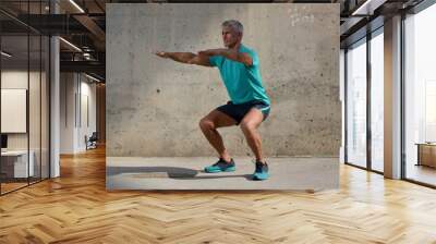 Elderly man practicing sports Wall mural