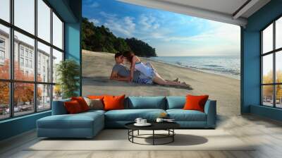 young romantic couple making out on secluded beach Wall mural