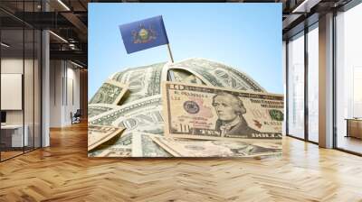 Flag of Pennsylvania sticking in a pile of american dollars.(ser Wall mural