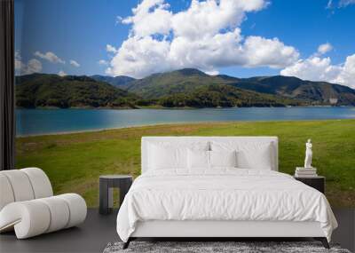 Lago Del Salto, in Lazio region (Italy),  reflects the sky and greenery Wall mural